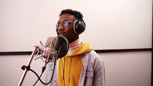 A Man is Singing while Checking the SoundTune 