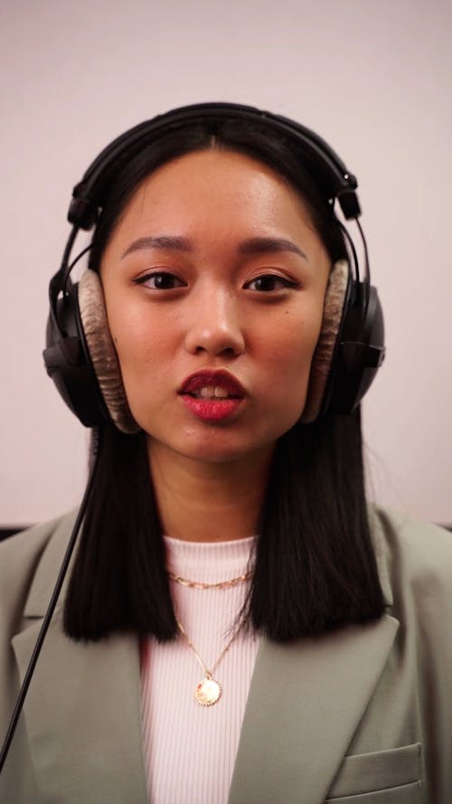 Woman is Talking while Looking at Camera