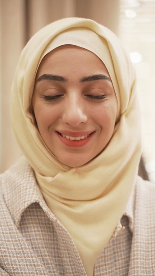 A Hijab Woman Posing while Looking at Camera