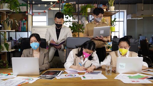 Colleagues Removing Their Face Masks