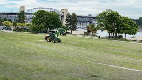A Tractor with a Loader in a Park