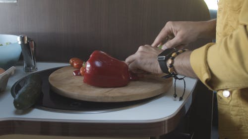 A Person Slicing Fresh Tomatoes