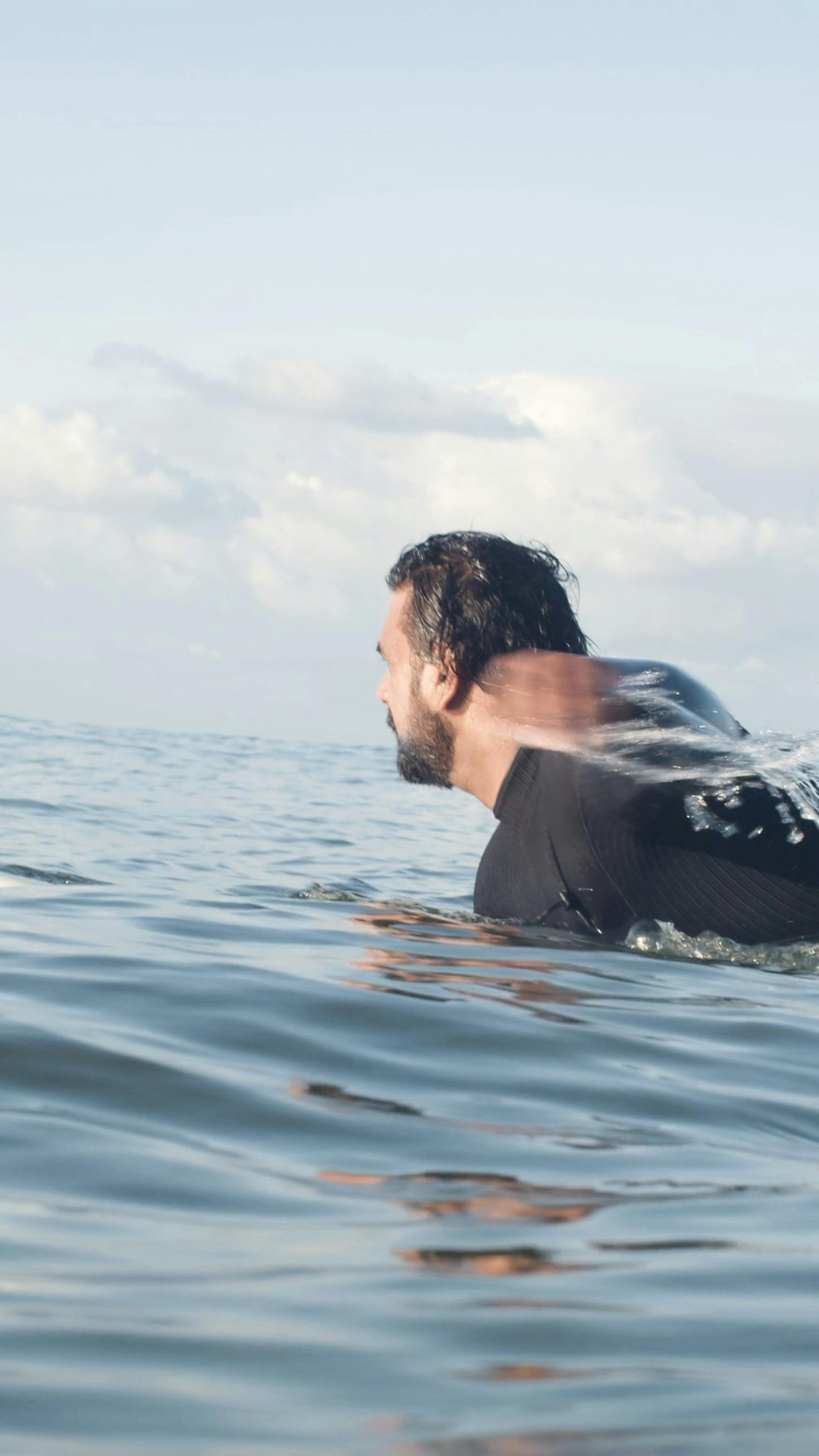 A Man Paddling While Using A Surfboard · Free Stock Video