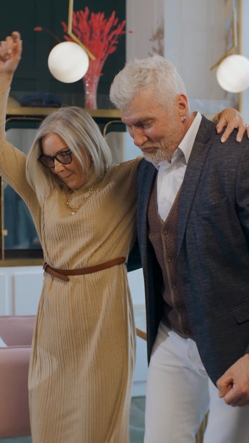 An Elderly Couple Dancing Together