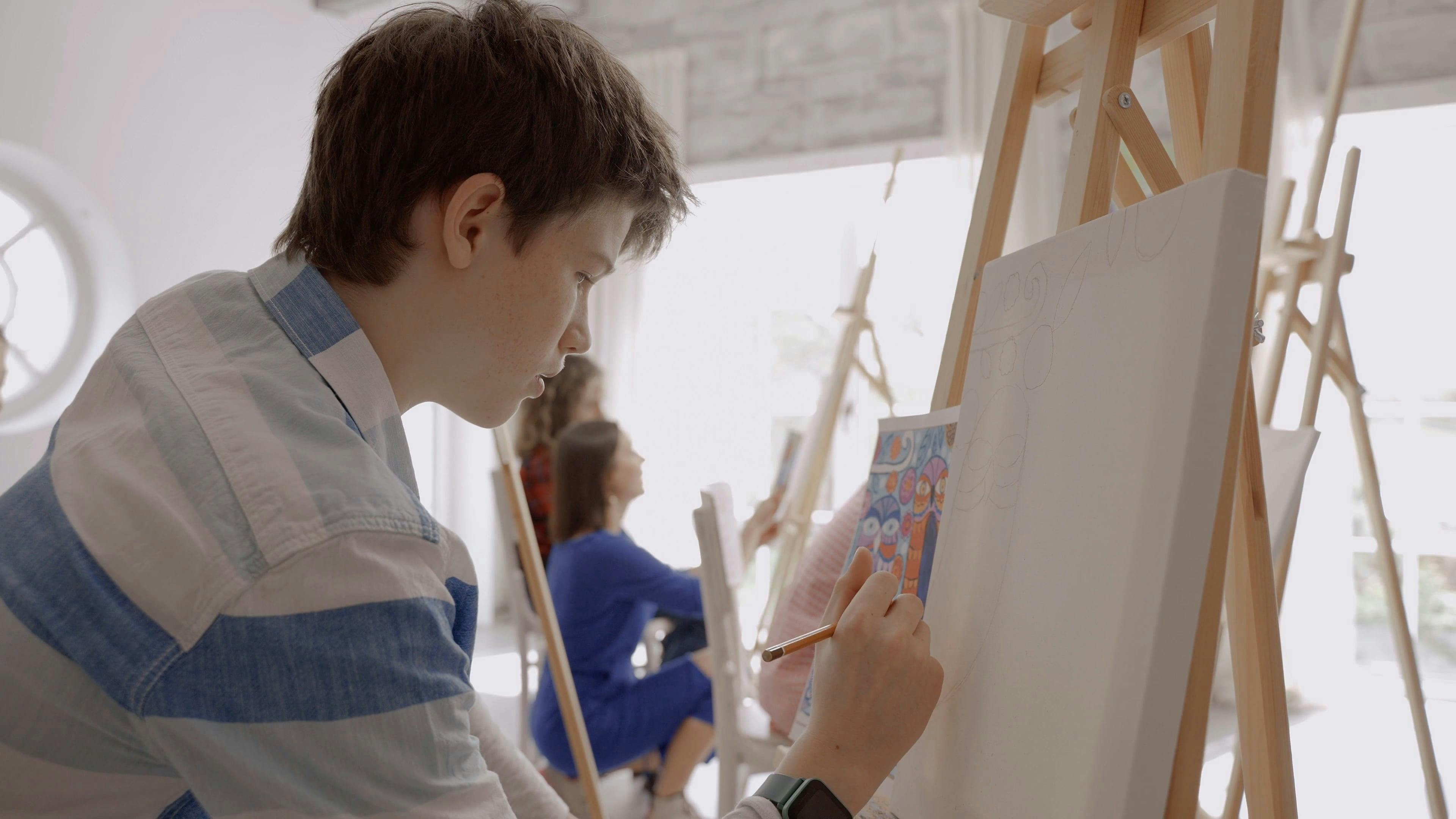 A Boy Drawing in an Art Class · Free Stock Video