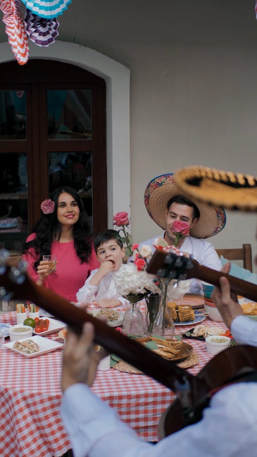 A Family Sitting at the Table