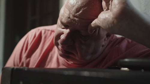 Close up of an Elderly Man with a Headache