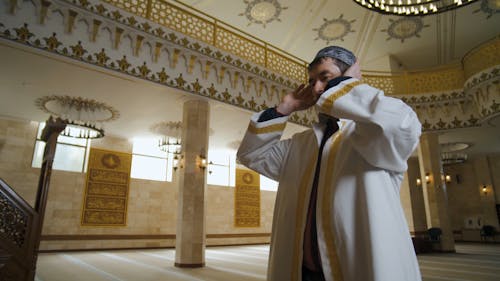 A Man Praying in a Mosque