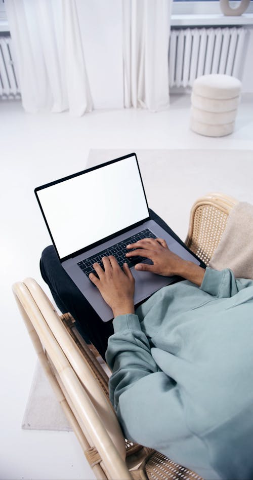 Person Typing on a Laptop