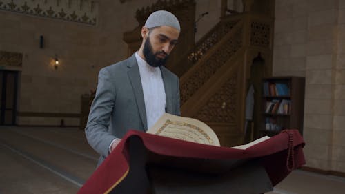Man Inside a Mosque Reading the Quran