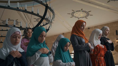 People Bowing Down and Kneeling while Praying 