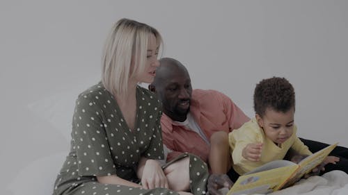 A Family Reading a Book Together