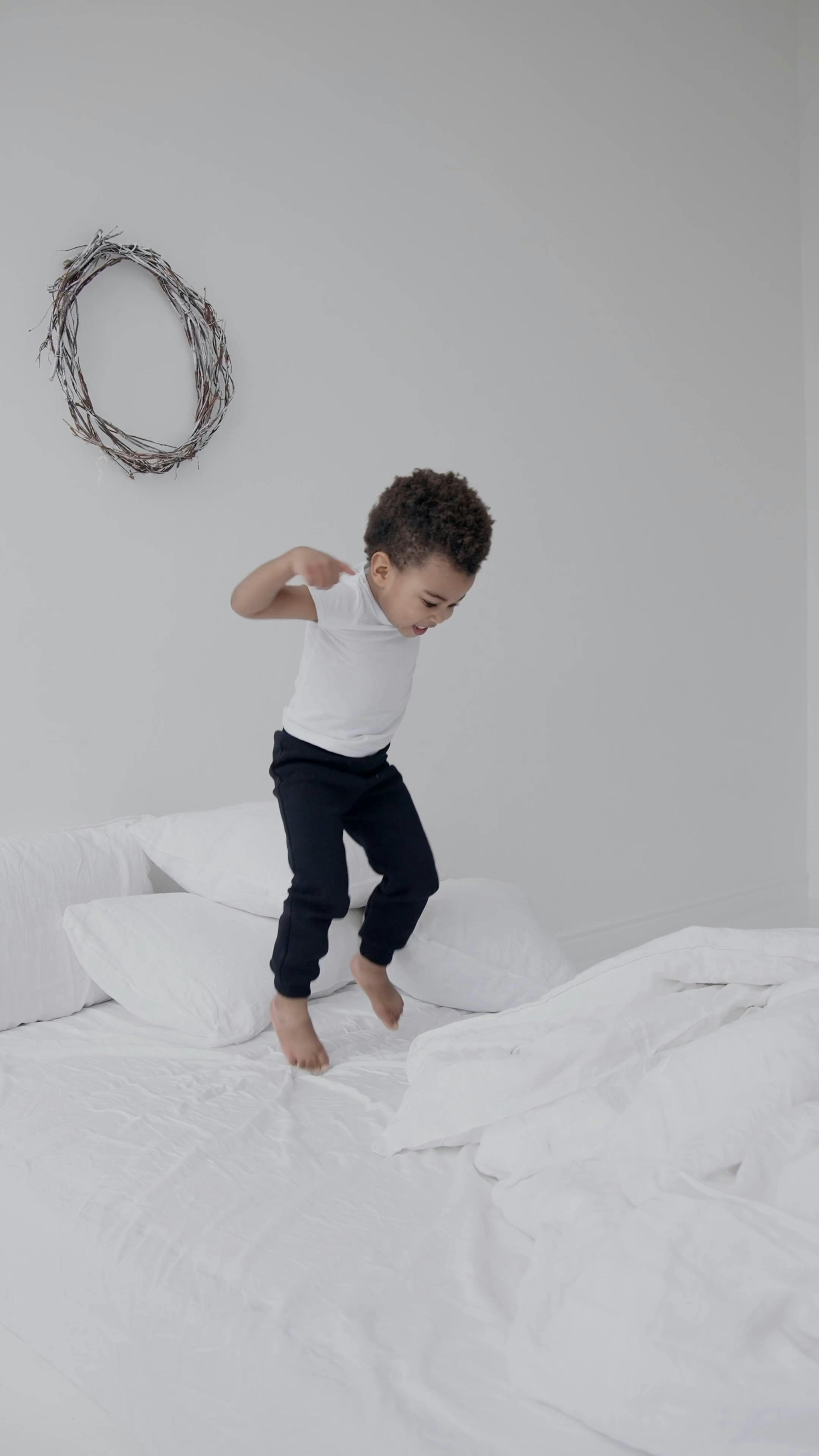 A Little Boy Jumping on the Bed · Free Stock Video