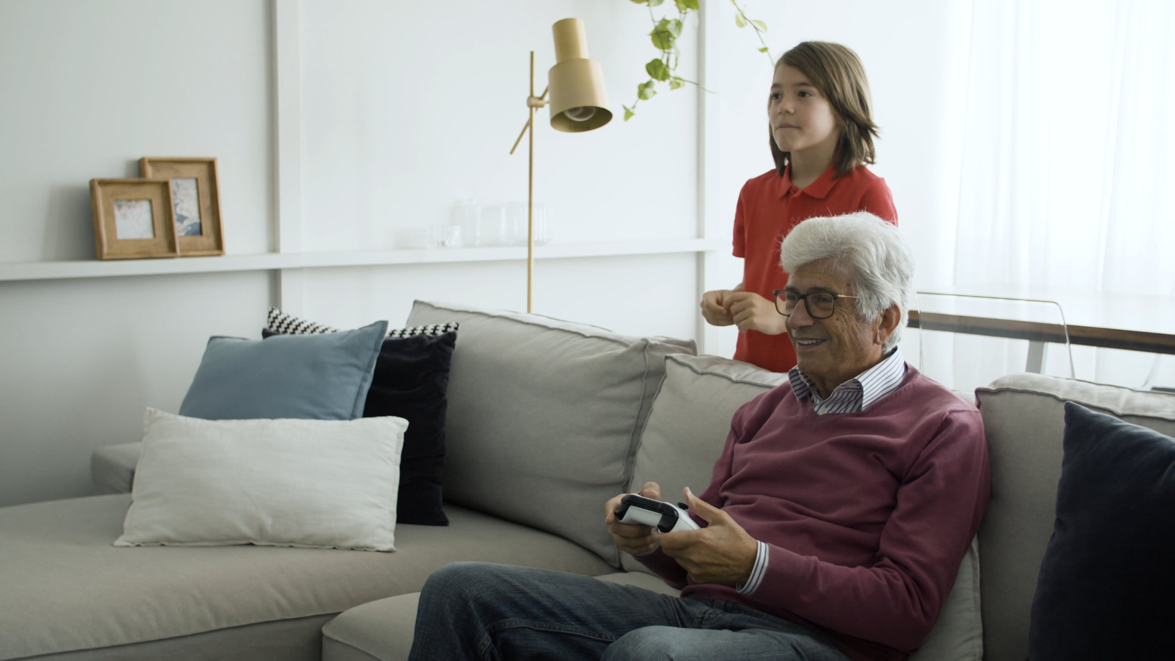Boy Teaching His Grandfather in Playing Video Games Free Stock Video ...