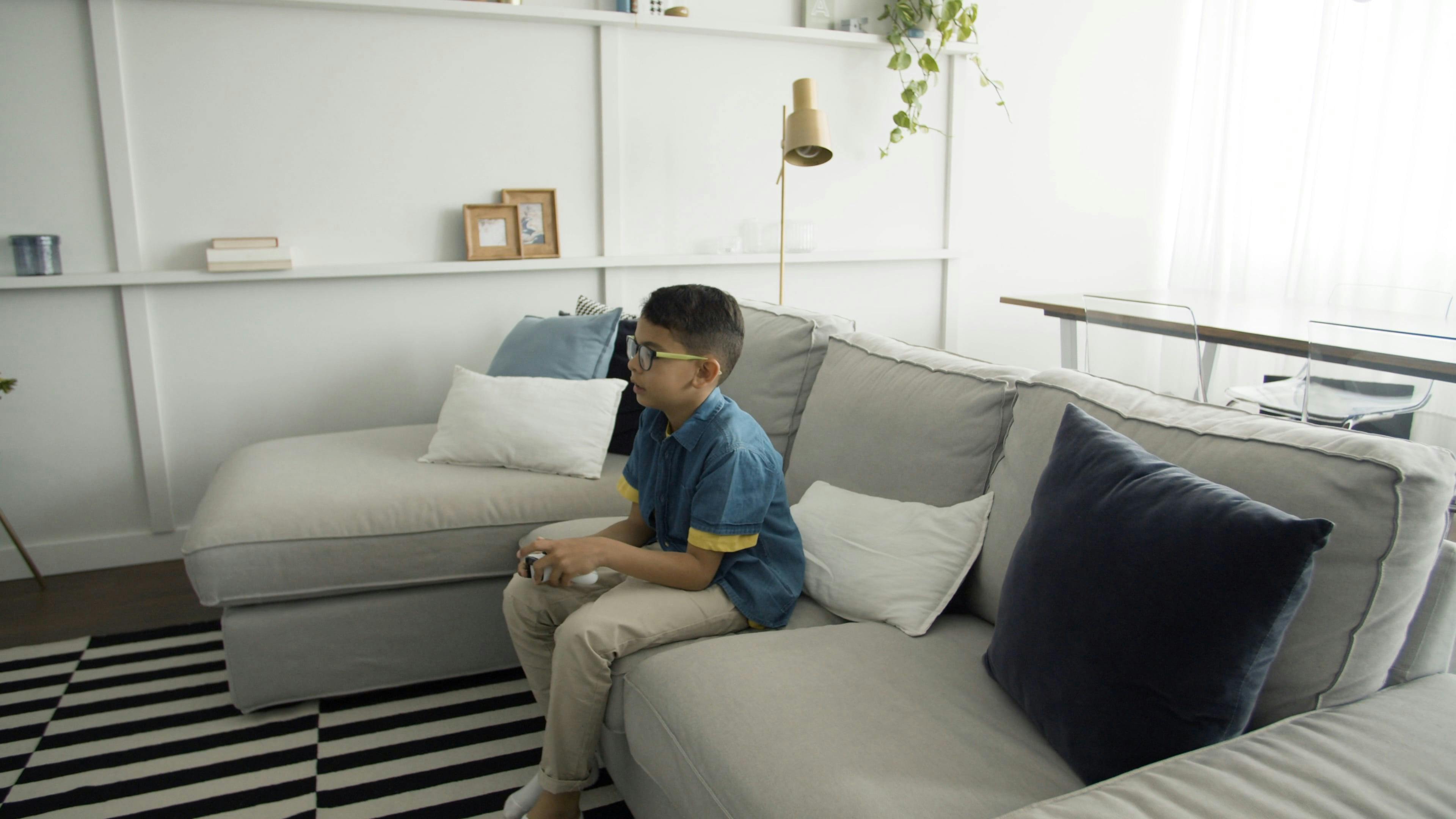 A Boy Playing Video Games in the Living Room · Free Stock Video