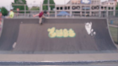 A Man Practicing Skateboarding in the Skatepark