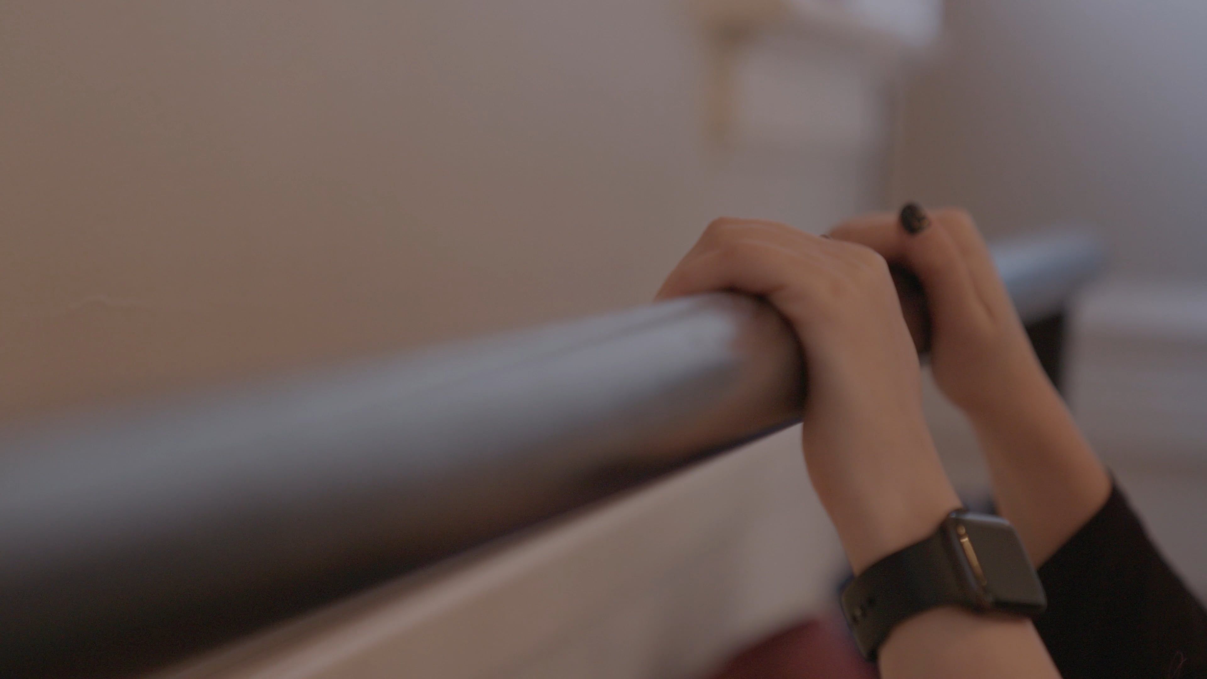 Person Walking While Holding On A Railing · Free Stock Video