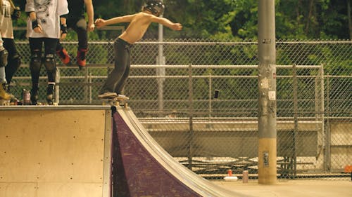 Boy Riding a Skateboard at a Skatepark