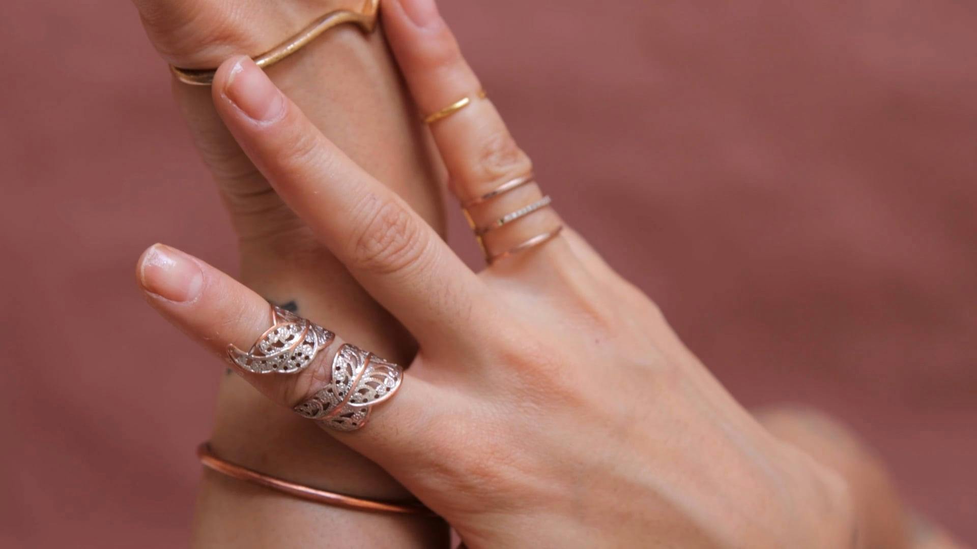 A Close Up of a Woman's Hands with Various Accessories · Free Stock Video