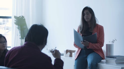 A Woman Holding A Business Meeting