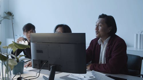 A Man Talking and Doing Hand Gestures at a Meeting