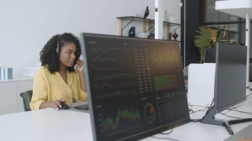 Customer Service Representatives Working in Front of Their Computers