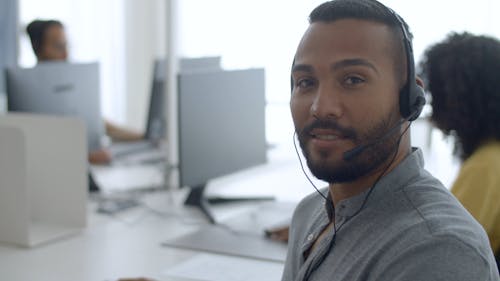 A Man Posing in an Office