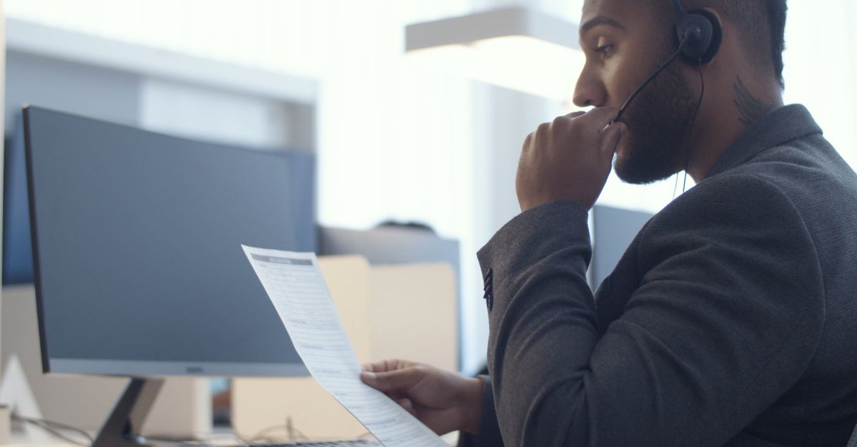 Male Call Center Agent Reading Information to His Customer Free Stock ...