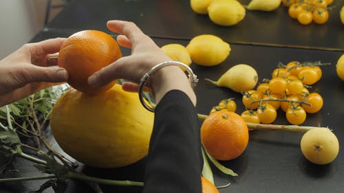 A Person Decorating the Fruits