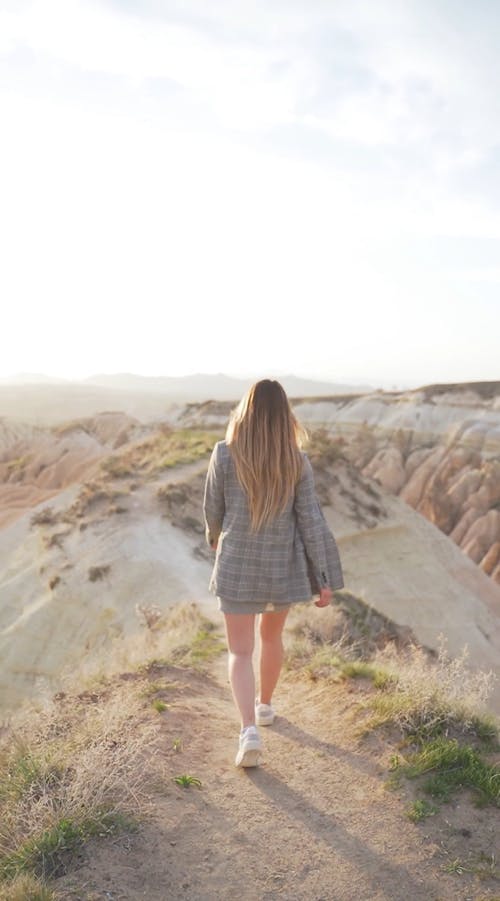 A Woman Walking on the Mountain