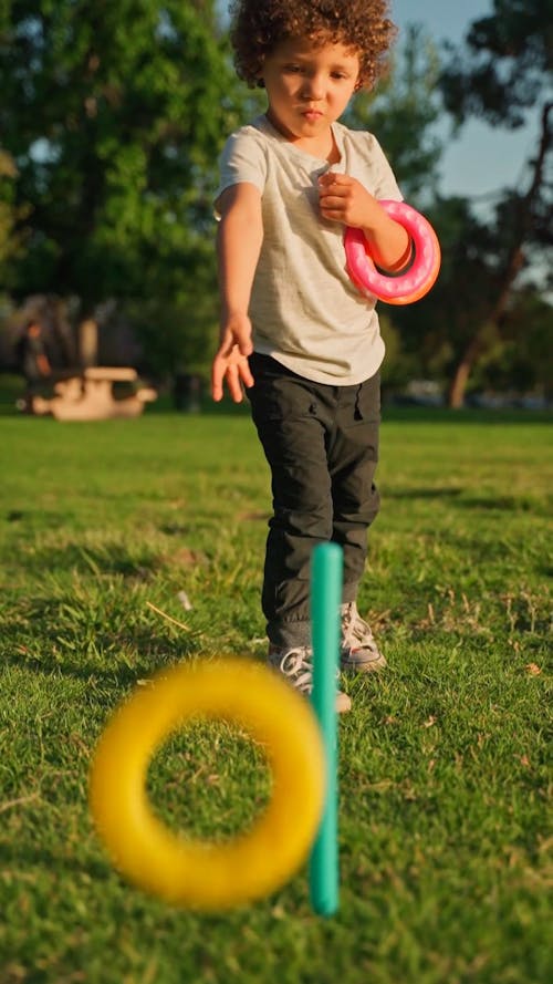 A Child Playing with Toys at the Park
