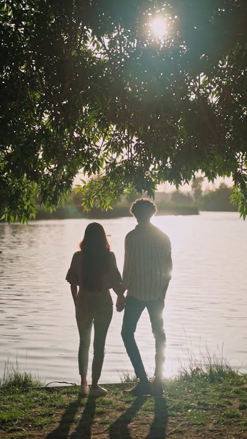 Couple Standing Near a Lake