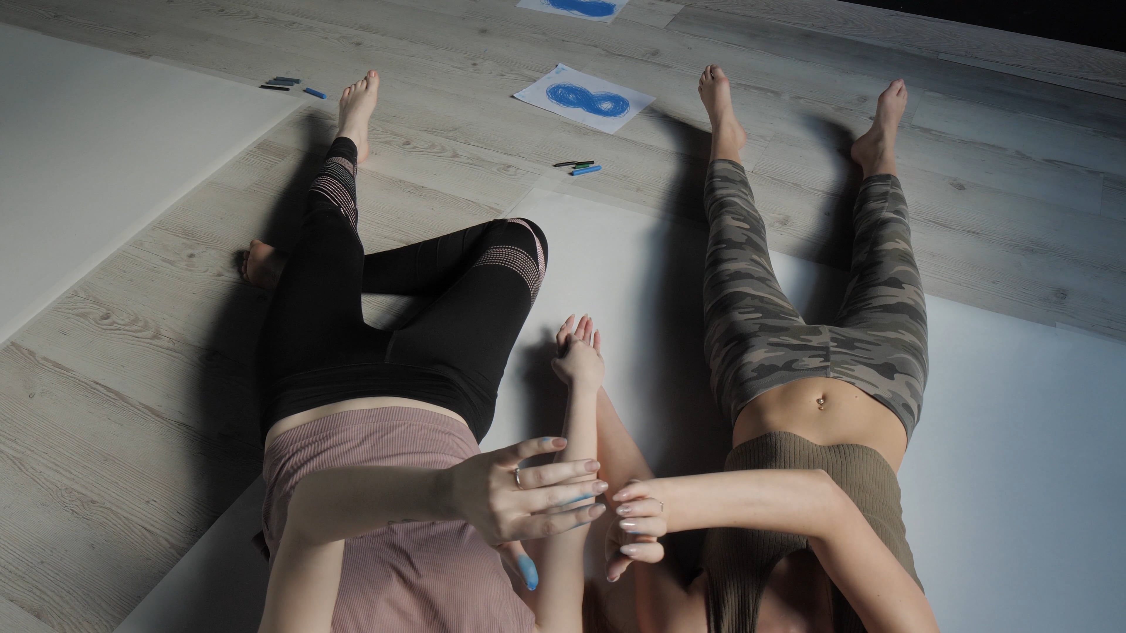 Women Moving their Hands while Lying on the Floor Free Stock Video ...