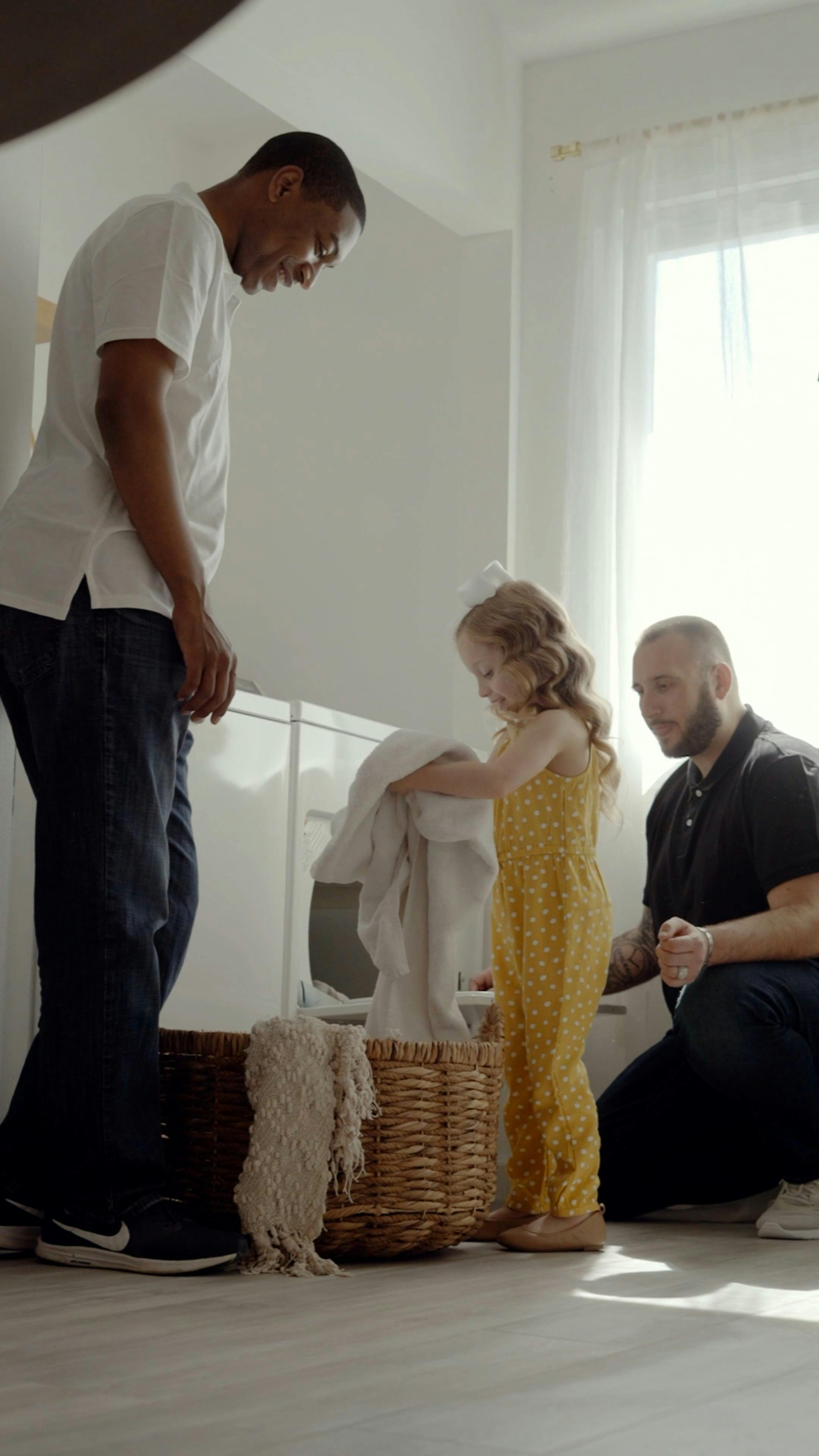 A Girl Helping Her Parents with Laundry · Free Stock Video