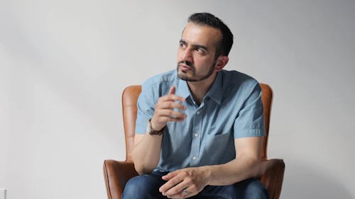 A Man Sitting in an Armchair