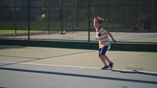 A Boy Playing Tennis