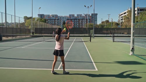 Girls Playing A Tennis