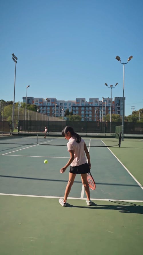 A Girl Playing A Tennis Game