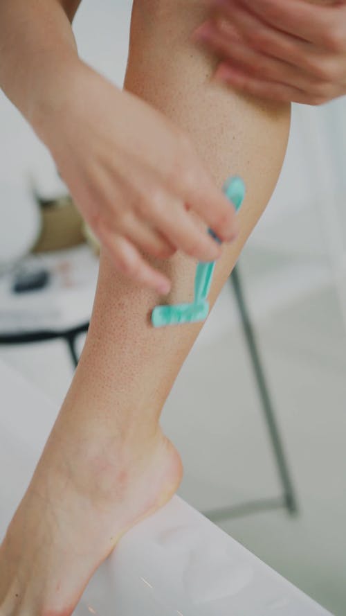 A Woman Shaving Her Feet · Free Stock Video