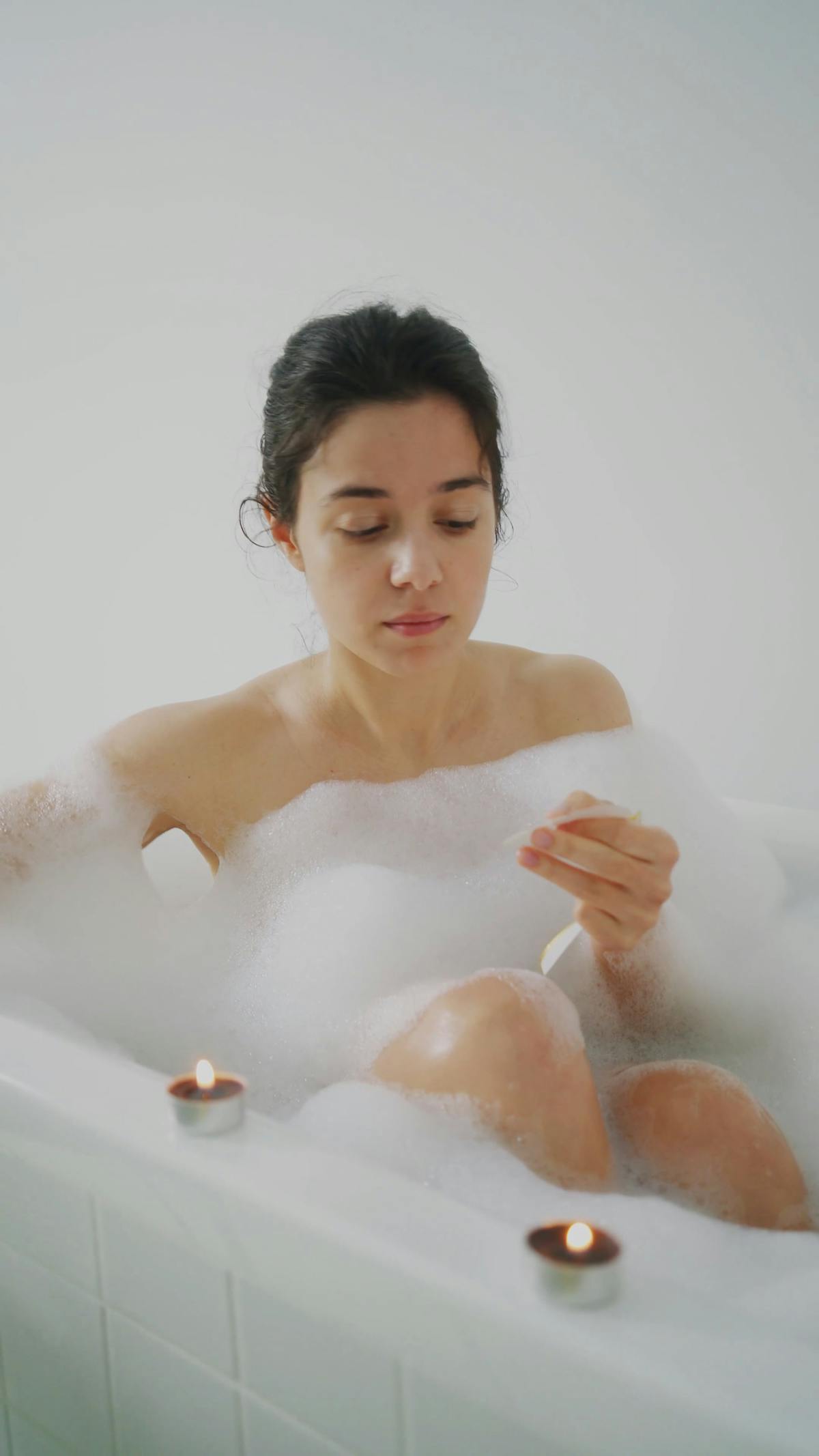 A Person In A Bathtub Holding A Bath Bomb Free Stock Video Footage Royalty Free 4k And Hd Video Clip 