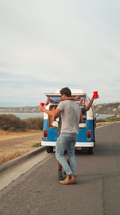 A Couple Dancing while on a Road Trip