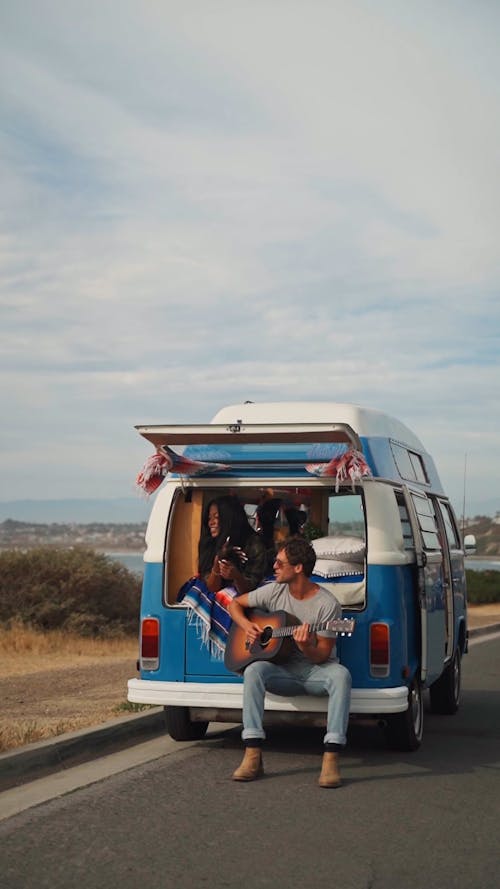 Couple Hanging Out in their Camper Van