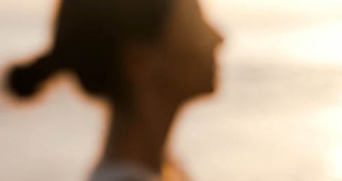 Woman Meditating on the Beach