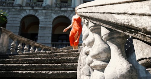 Woman Walking Down Stairs