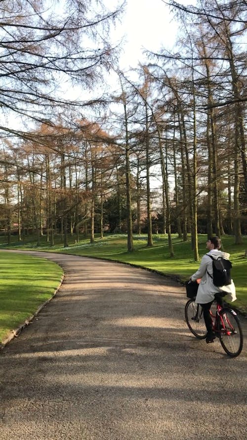 Person Biking on an Empty Road