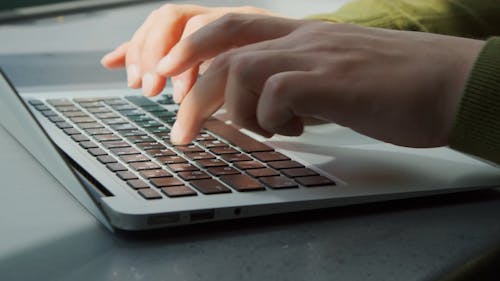 A Person Working on Laptop