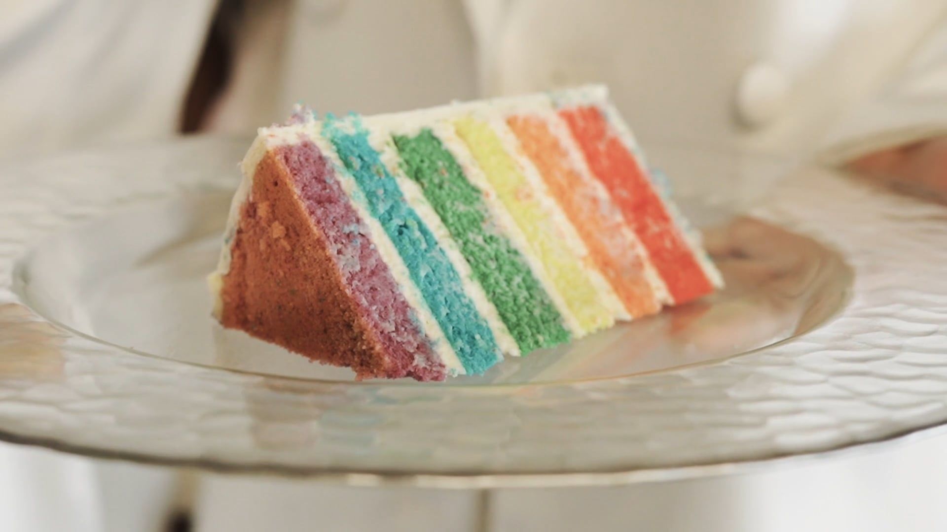 a-couple-holding-a-plate-with-a-rainbow-layer-cake-free-stock-video