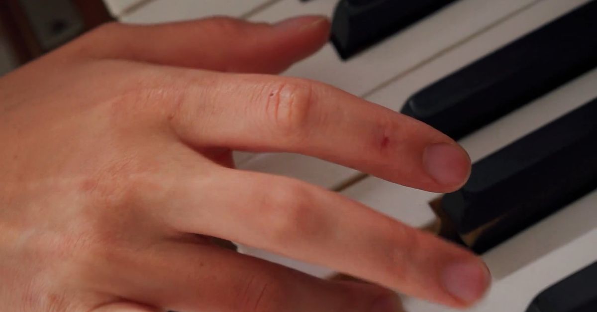 Keypress Hand A Person's Hand Pressing Piano Keys Free Stock Video Footage, Royalty ...