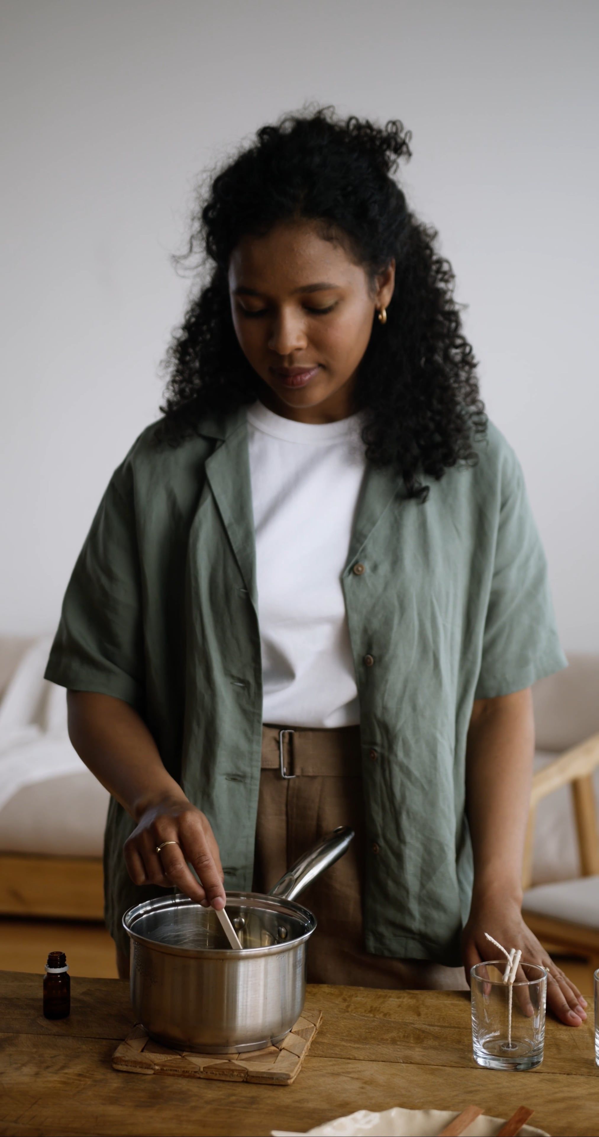A Woman Smelling the Stick She Used in Stirring the Liquid on a Cooking ...