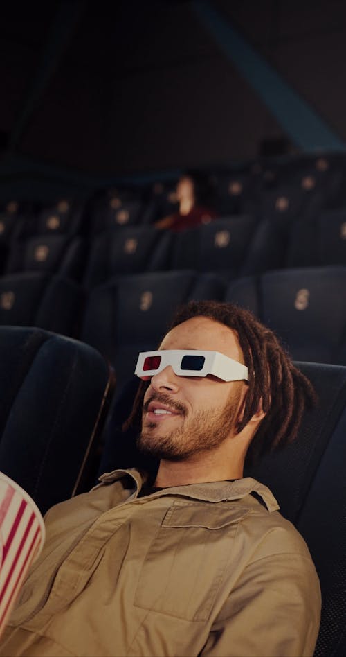 A Man Eating Popcorn